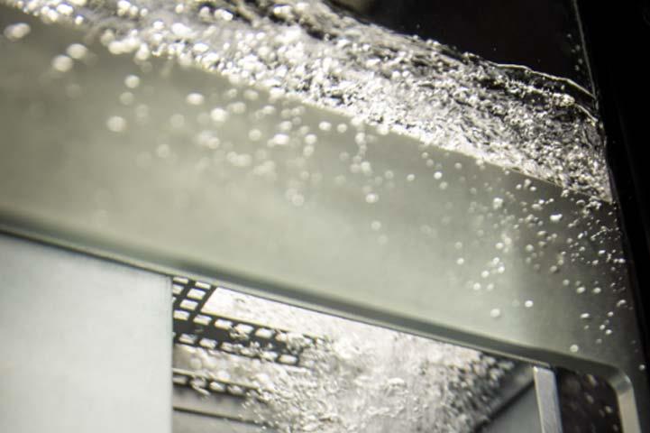 Cooling liquid cascading over a device