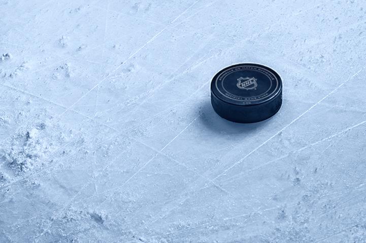 NHL Hockey puck resting on ice