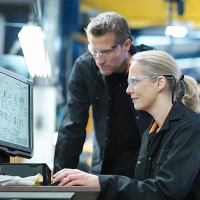 two people working on a computer